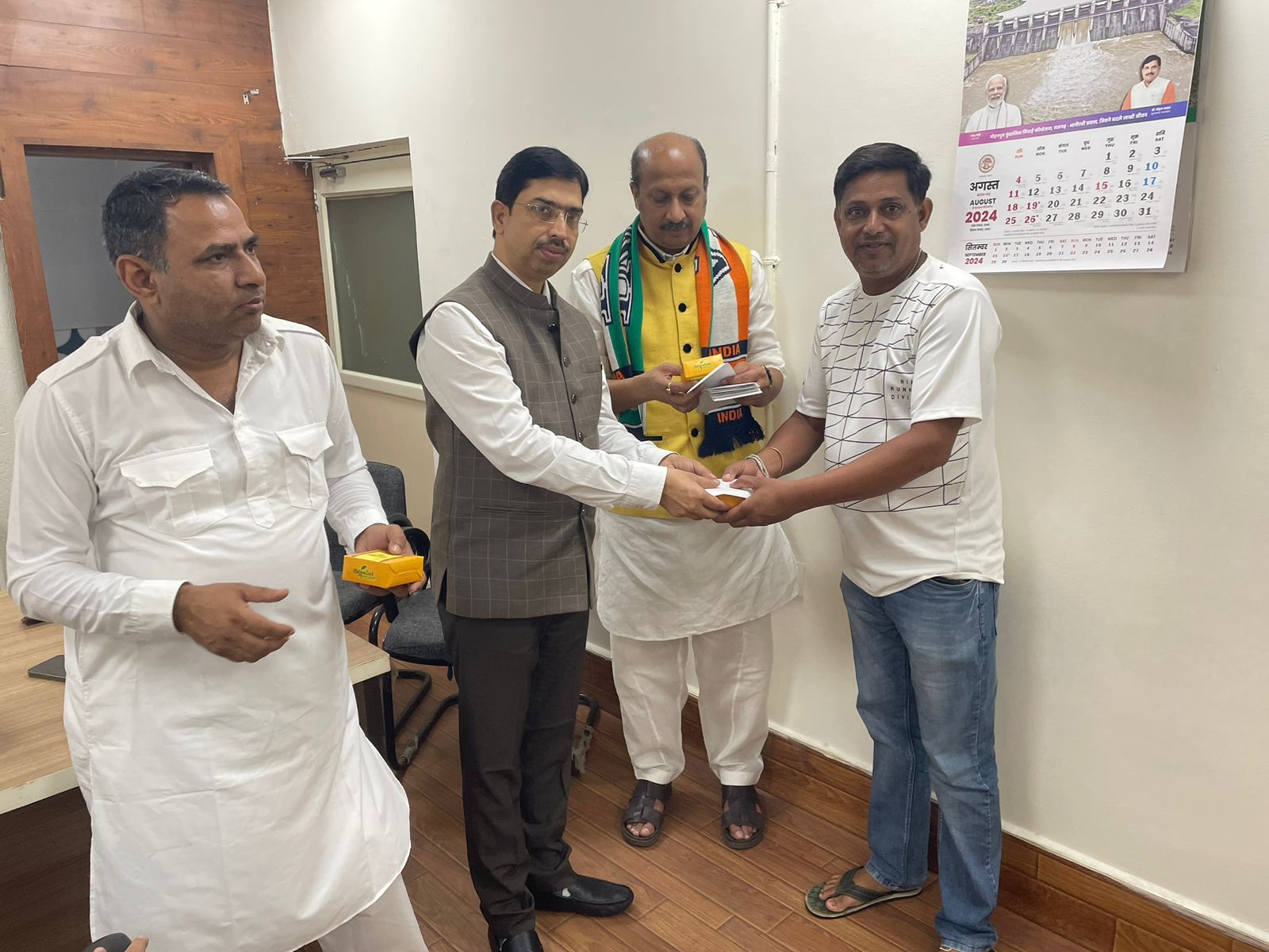 Flag hoisting, guard salute and sweets distributed at the Rajdhani bungalow of Minister Rakesh Shukla.